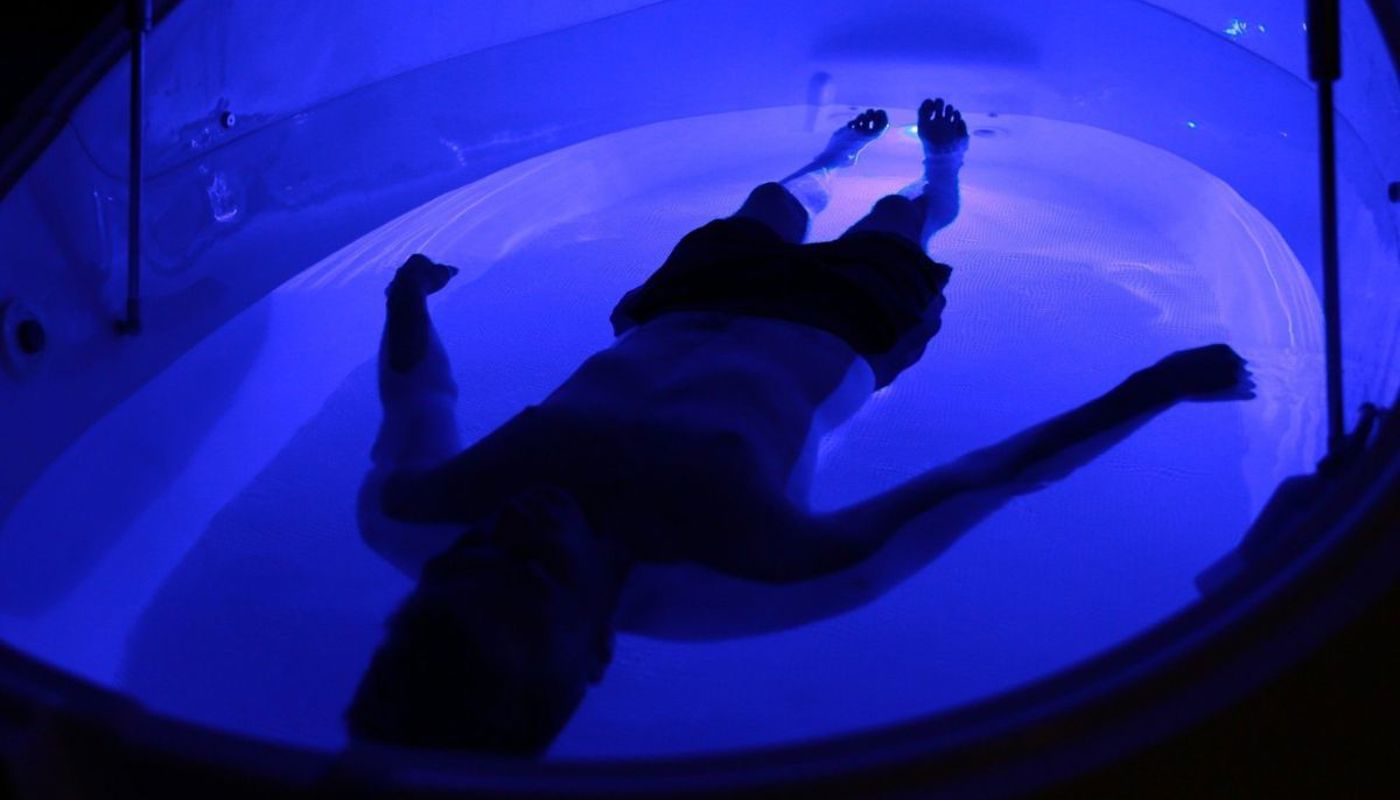 Person floating in pod