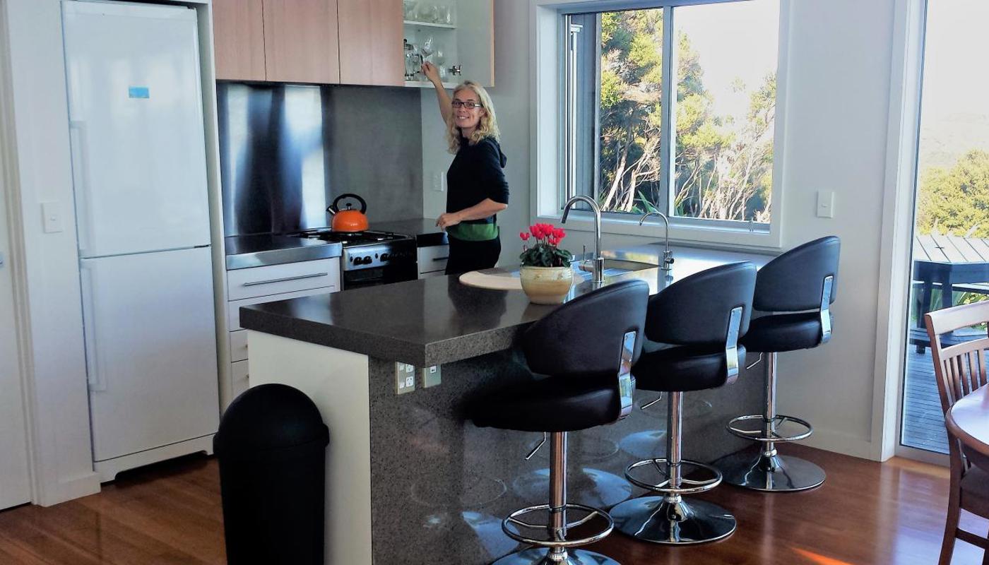 Spacious kitchen with fridge freezer, gas stove/oven and a wood stove.